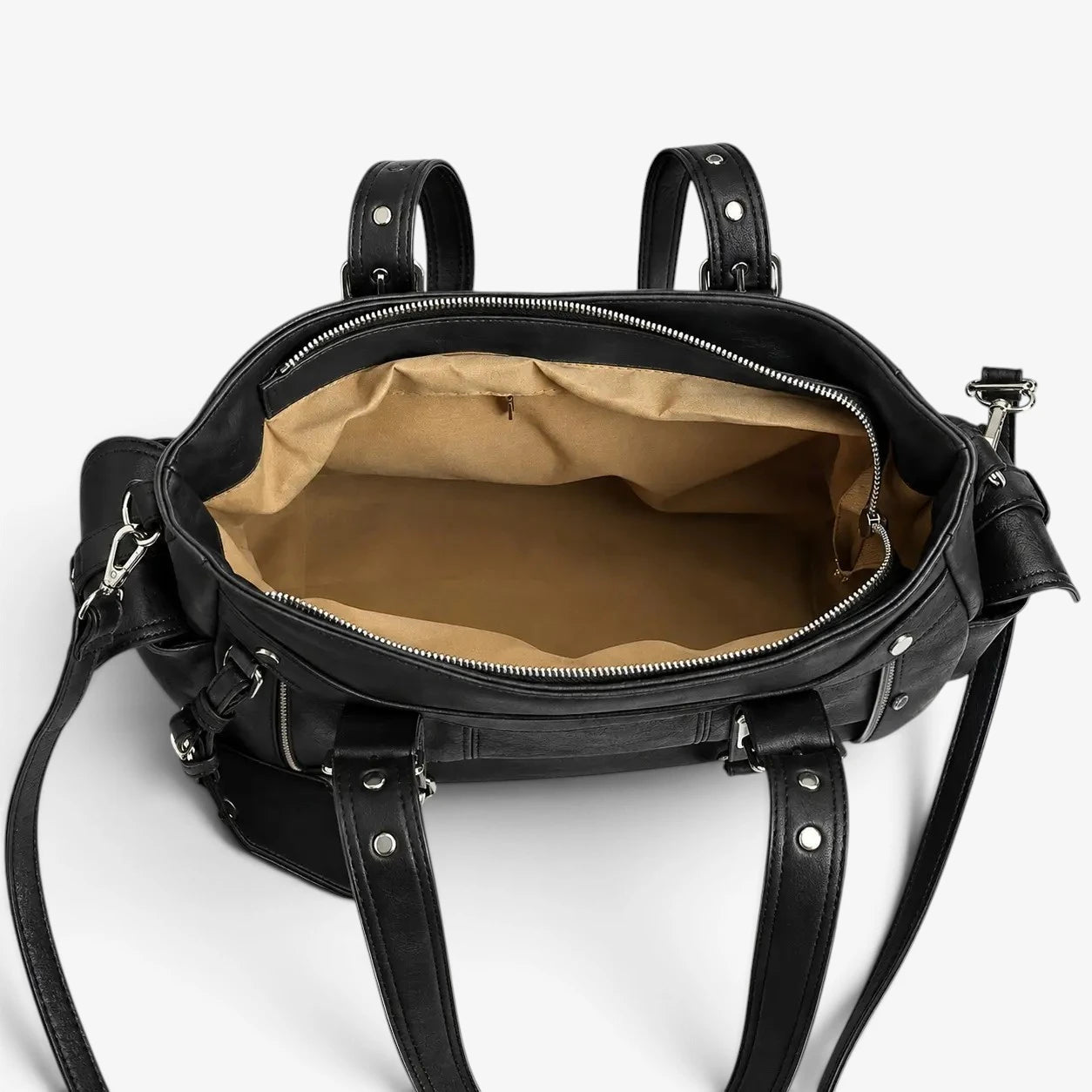 Intérieur ouvert du sac cabas noir avec doublure beige et compartiment principal