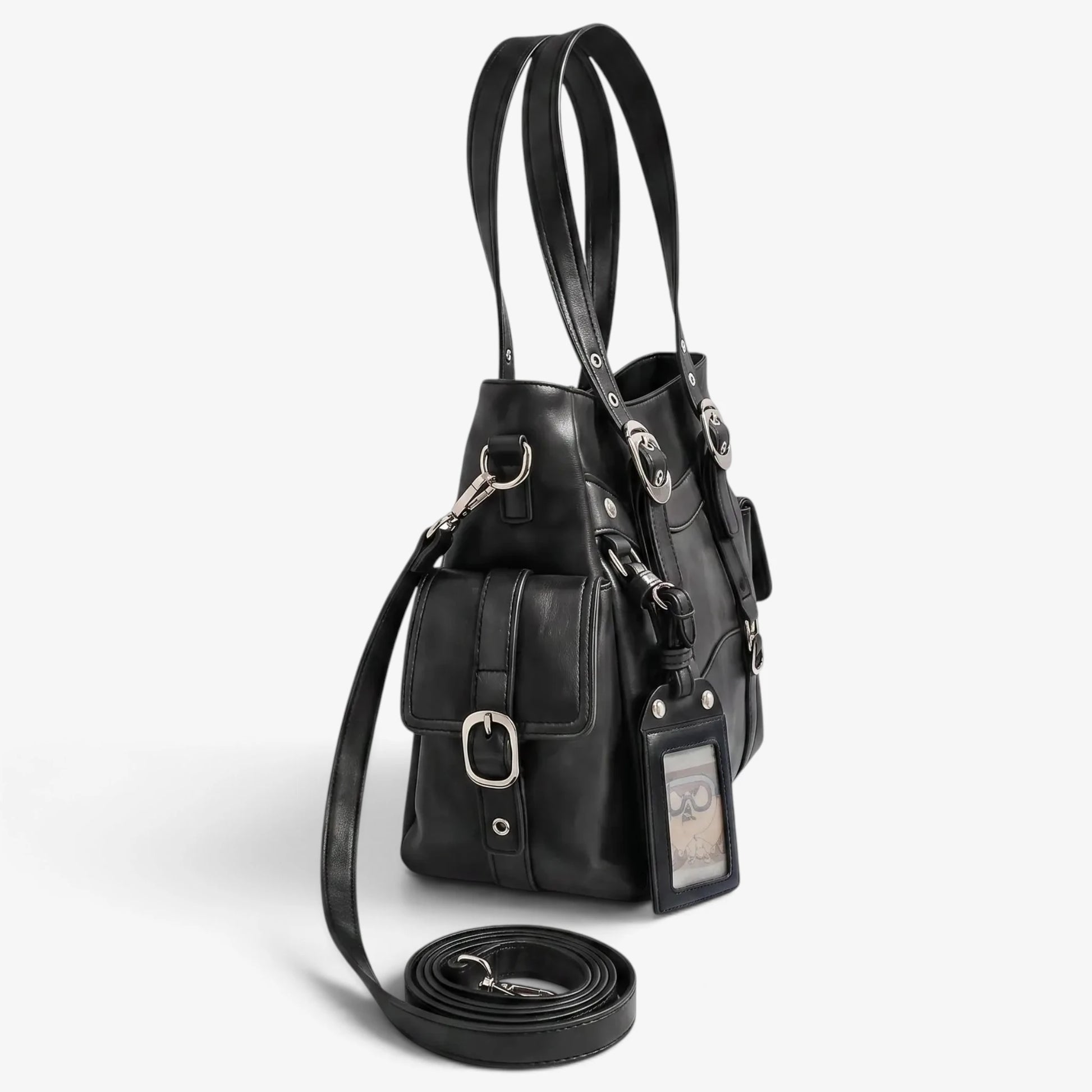 Sac cabas noir vu de profil avec bandoulière posée au sol
