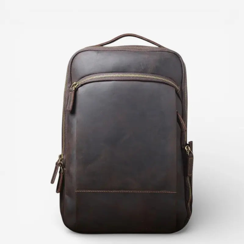 Vue de face sac à dos cuir véritable brun foncé avec poche avant zippée