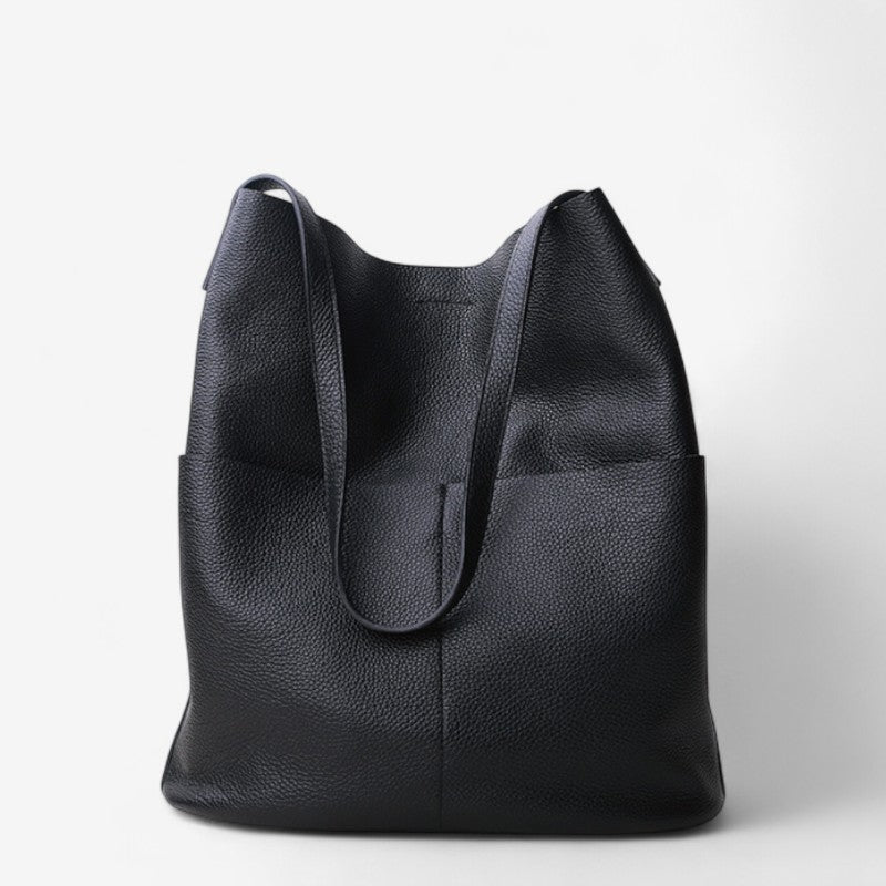 Vue de face du sac fourre-tout noir en cuir grainé à poignées souples