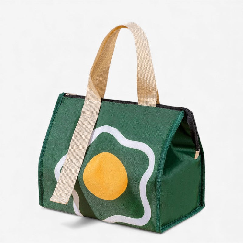 Sac isotherme vert décoré d’un motif œuf jaune et blanc