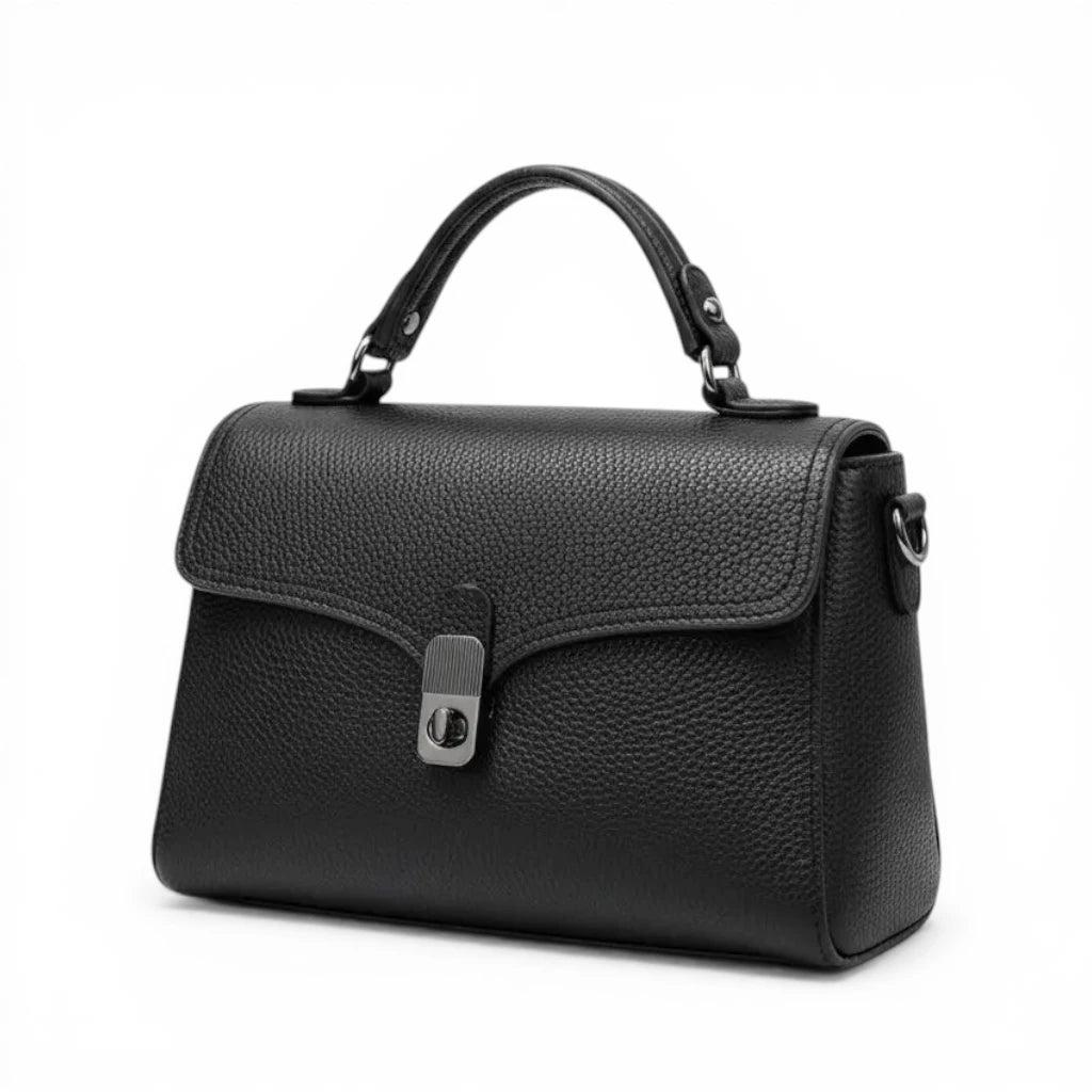 Sac à main noir en cuir de vachette avec poignée rigide et fermeture à rabat élégante