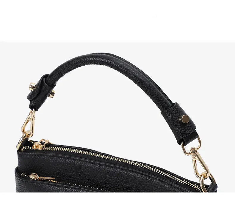 Sac à main rectangulaire en cuir de vachette noir pour femme, gros plan sur la poignée renforcée