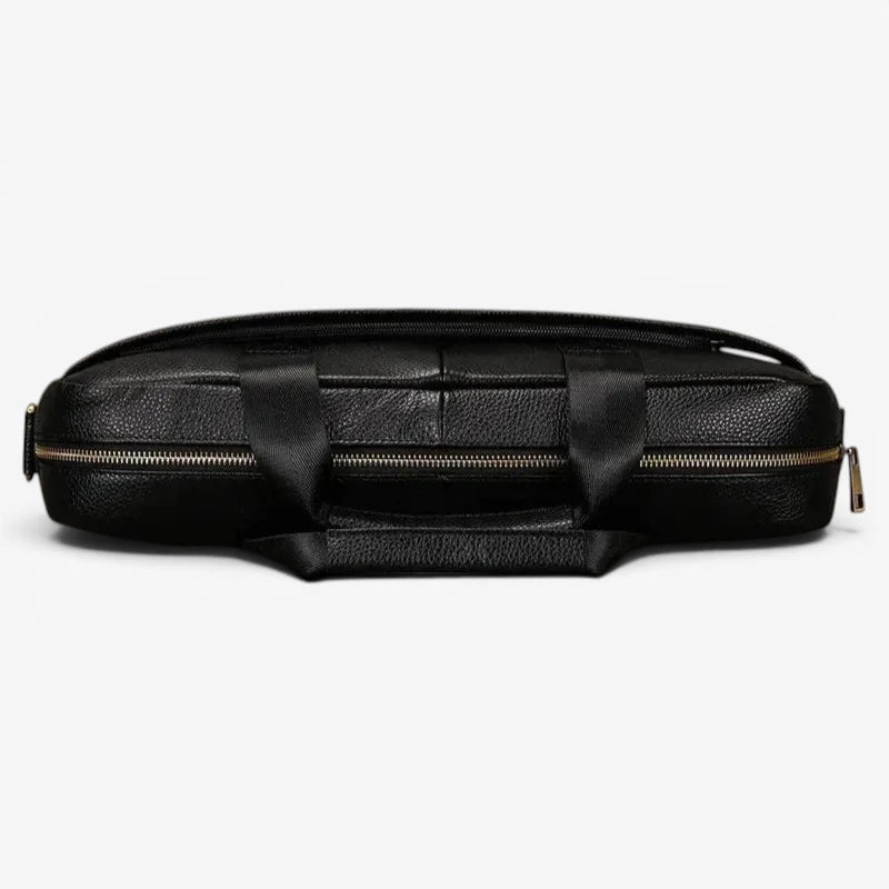 Vue du dessus du sac ordinateur en cuir noir avec fermeture zippée