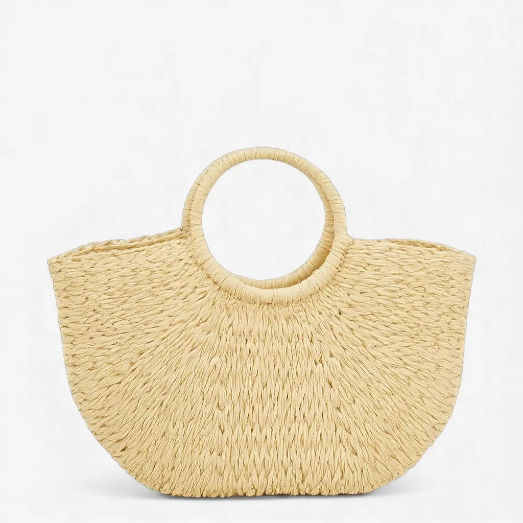 Sac en paille forme coquillage avec anses rondes rigides présenté de face