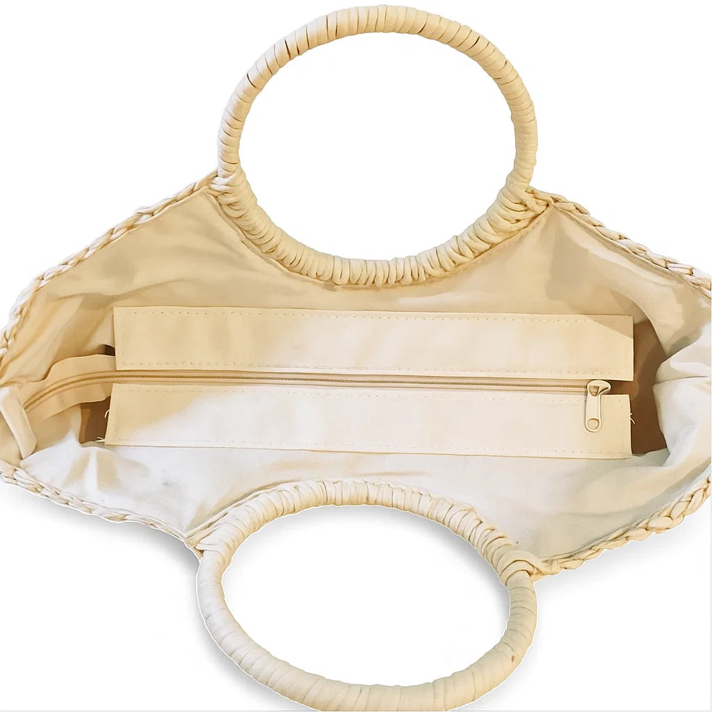 Intérieur du sac en paille forme coquillage avec doublure polyester et poche zippée