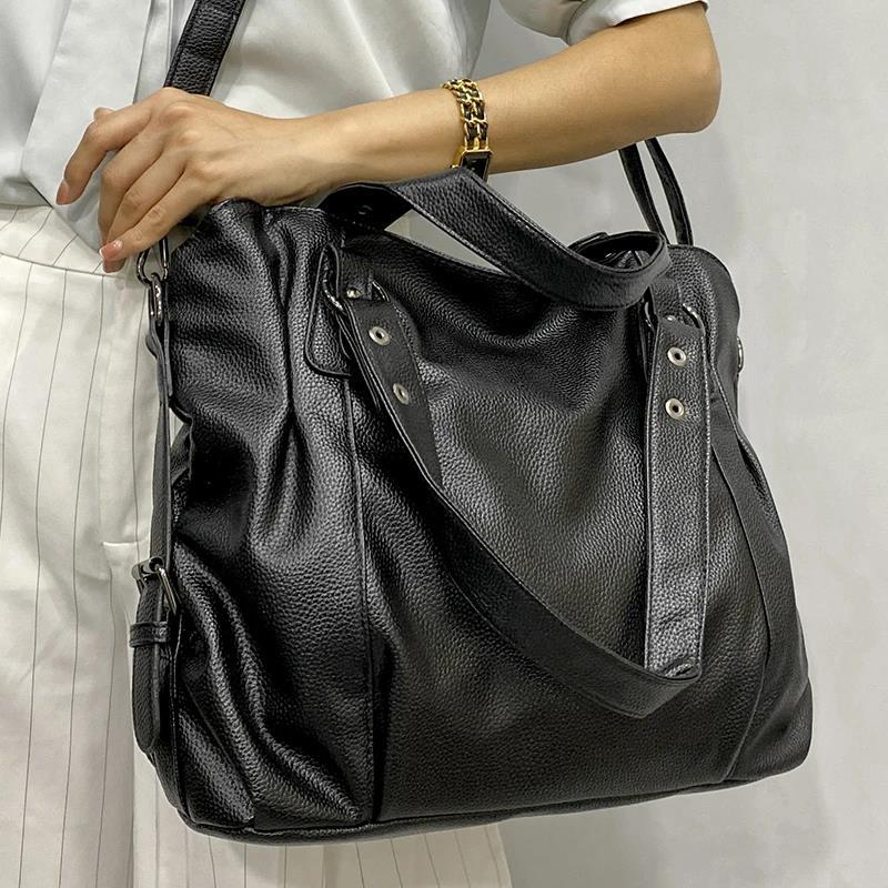 Sac porté épaule noir grande capacité porté à la main