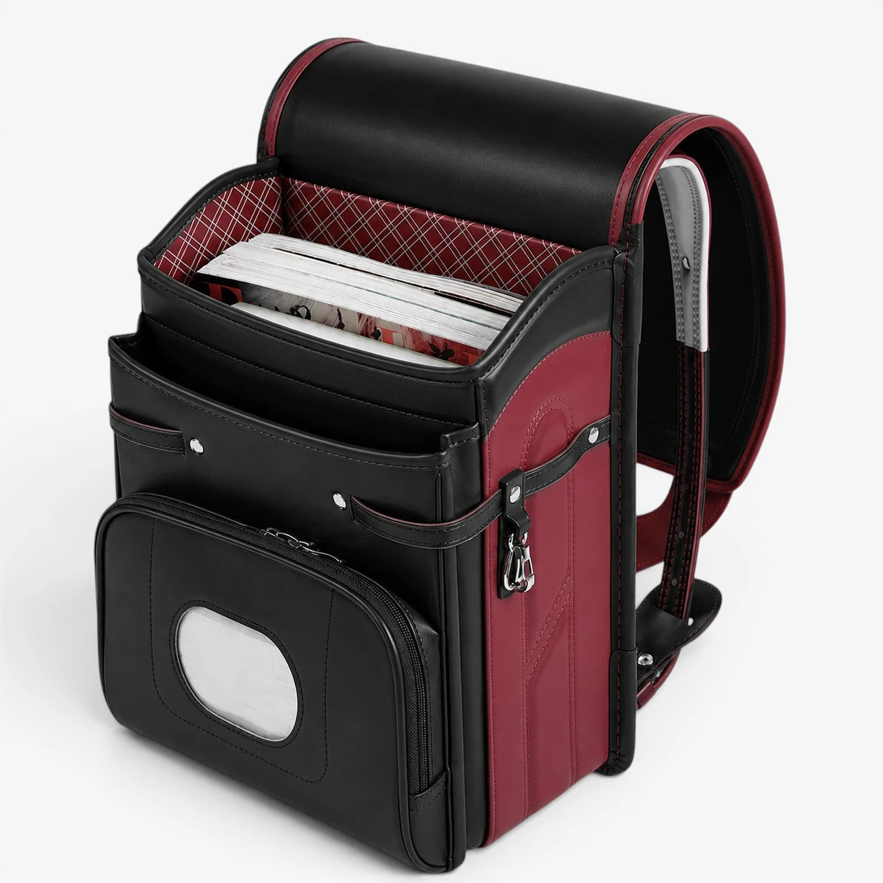 Intérieur du sac randoseru japonais noir avec compartiments de rangement