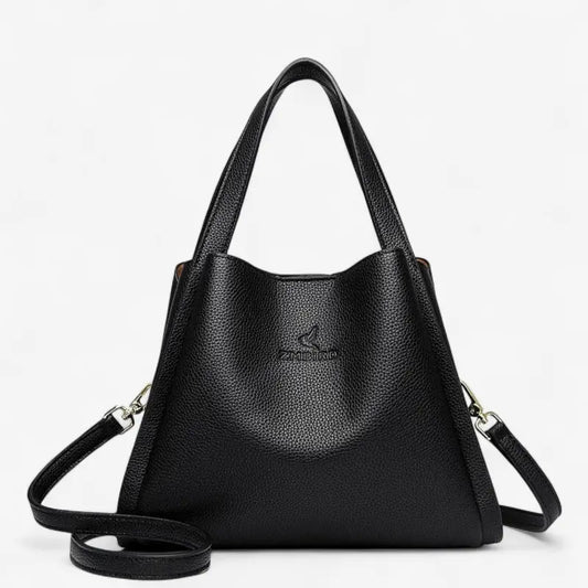 Sac seau noir en cuir synthétique souple avec bandoulière amovible et poignées renforcées