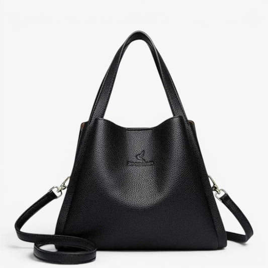 Sac seau noir en cuir synthétique souple avec bandoulière amovible et poignées renforcées