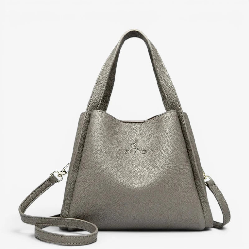 Sac seau gris en cuir synthétique souple avec finition lisse et anses solides