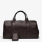 vue de face du sac de voyage en cuir marron foncé avec porte-étiquette