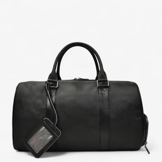 sac de voyage en cuir noir petit format – vue de face avec étiquette porte-nom