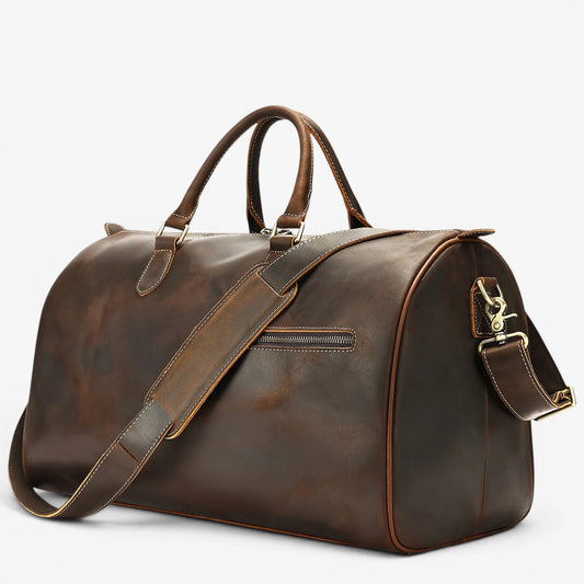 Sac de voyage en cuir de vachette marron  foncé avec bandoulière réglable et poche extérieure zippée