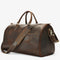 Sac de voyage en cuir de vachette marron  foncé avec bandoulière réglable et poche extérieure zippée