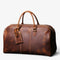 Sac de voyage en cuir de vachette vintage marron avec doubles poignées et fermeture zippée