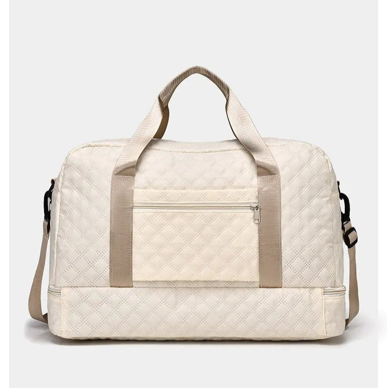 Vue arrière d’un sac de voyage femme beige avec fixation trolley