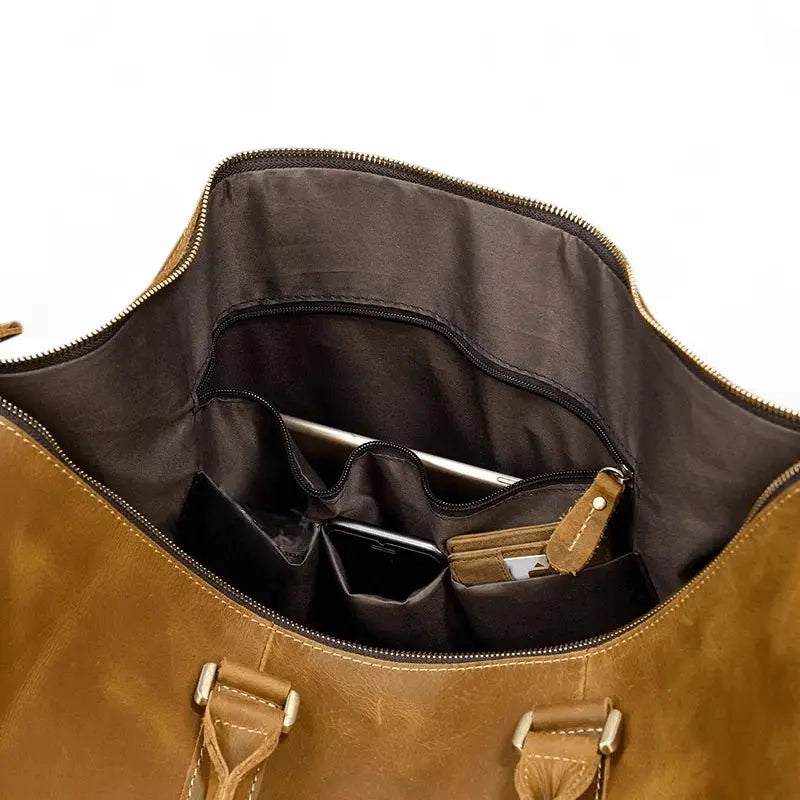 Intérieur spacieux avec compartiments du sac de voyage homme en cuir véritable